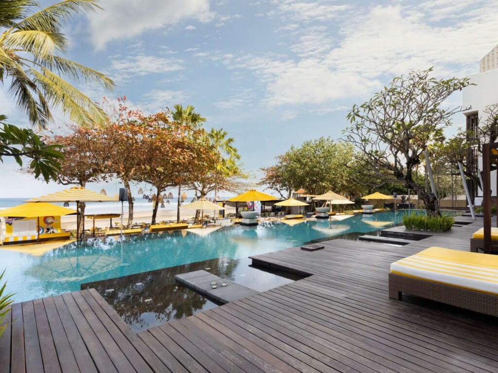 Seminyak beach resort with palm trees and sunset views