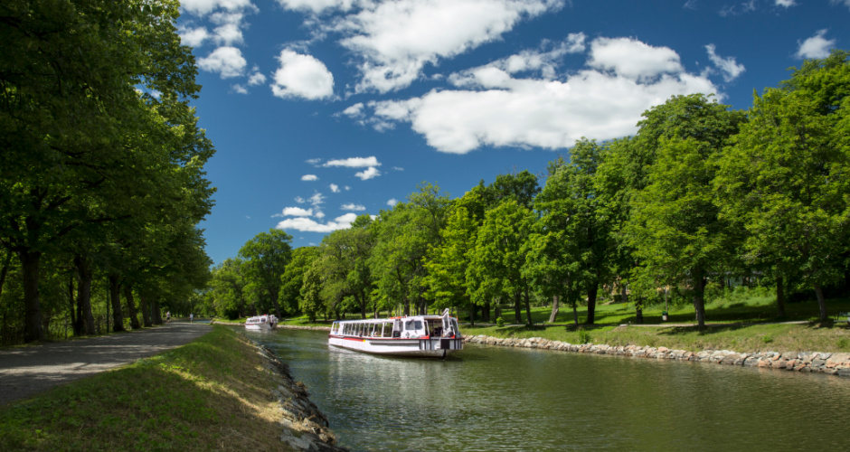 Green park and walking path on Djurgården island in Stockholm