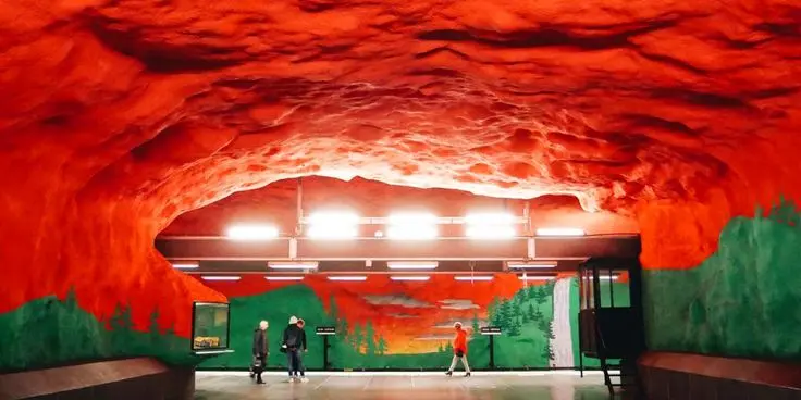 Red ceiling and green forest artwork at Solna Centrum metro station