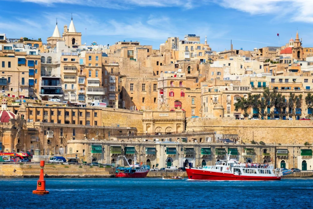 Grand Harbour in Valletta Malta with historic limestone buildings and Mediterranean sea views