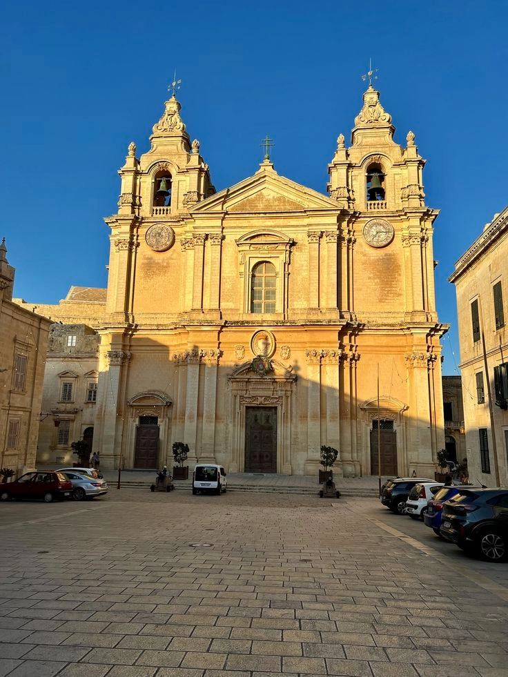 Narrow historic street in Mdina and Rabat Malta with old stone walls and traditional architecture