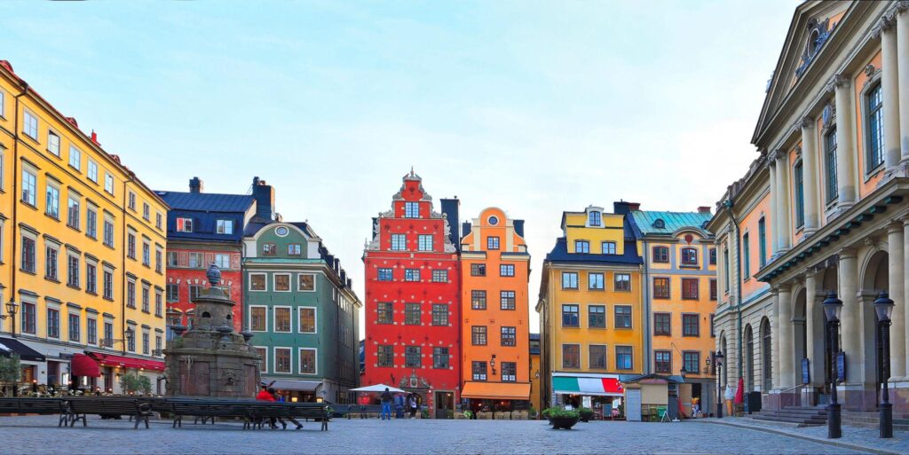 Colorful historic buildings and cobblestone street in Gamla Stan old town Stockholm