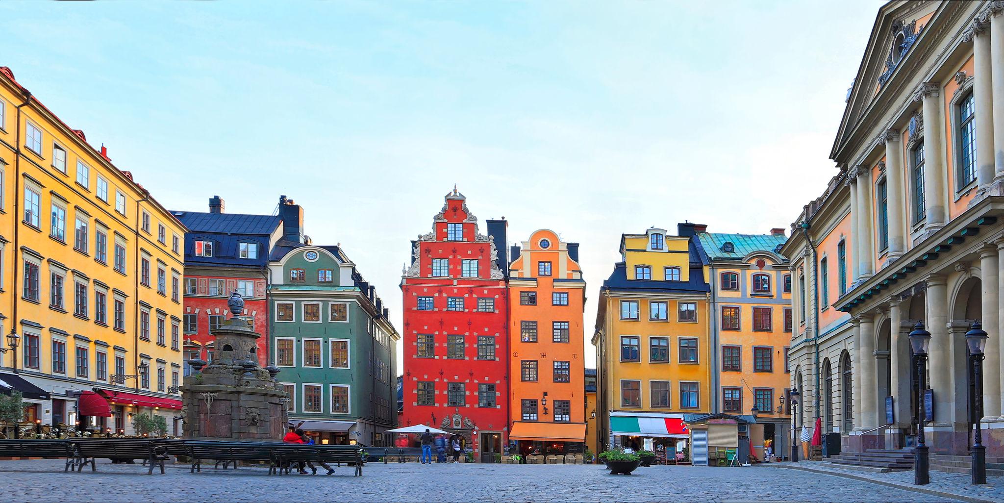Colorful historic buildings and cobblestone street in Gamla Stan old town Stockholm