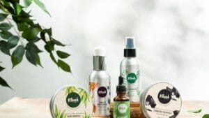 Close-up of natural skincare products including aloe vera gel and charcoal face mask.