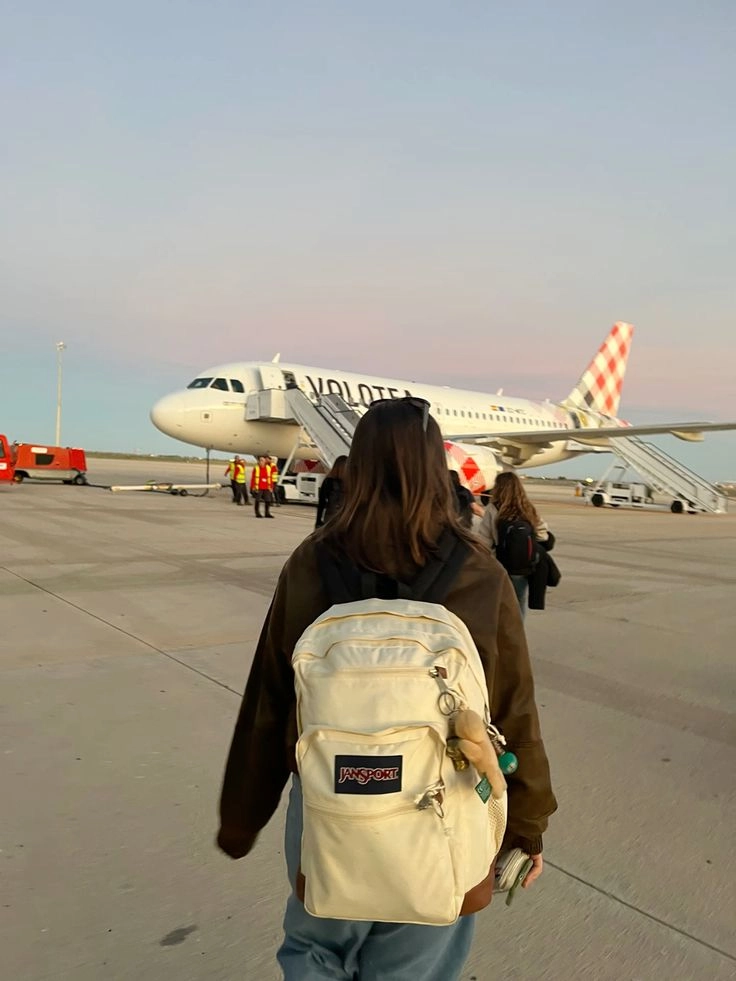 Budget travel guide essentials with backpack, map, and travel notebook