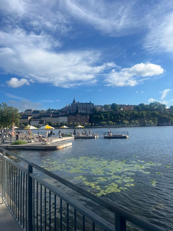 Colorful buildings and boats along Stockholm’s waterfront on a bright summer day